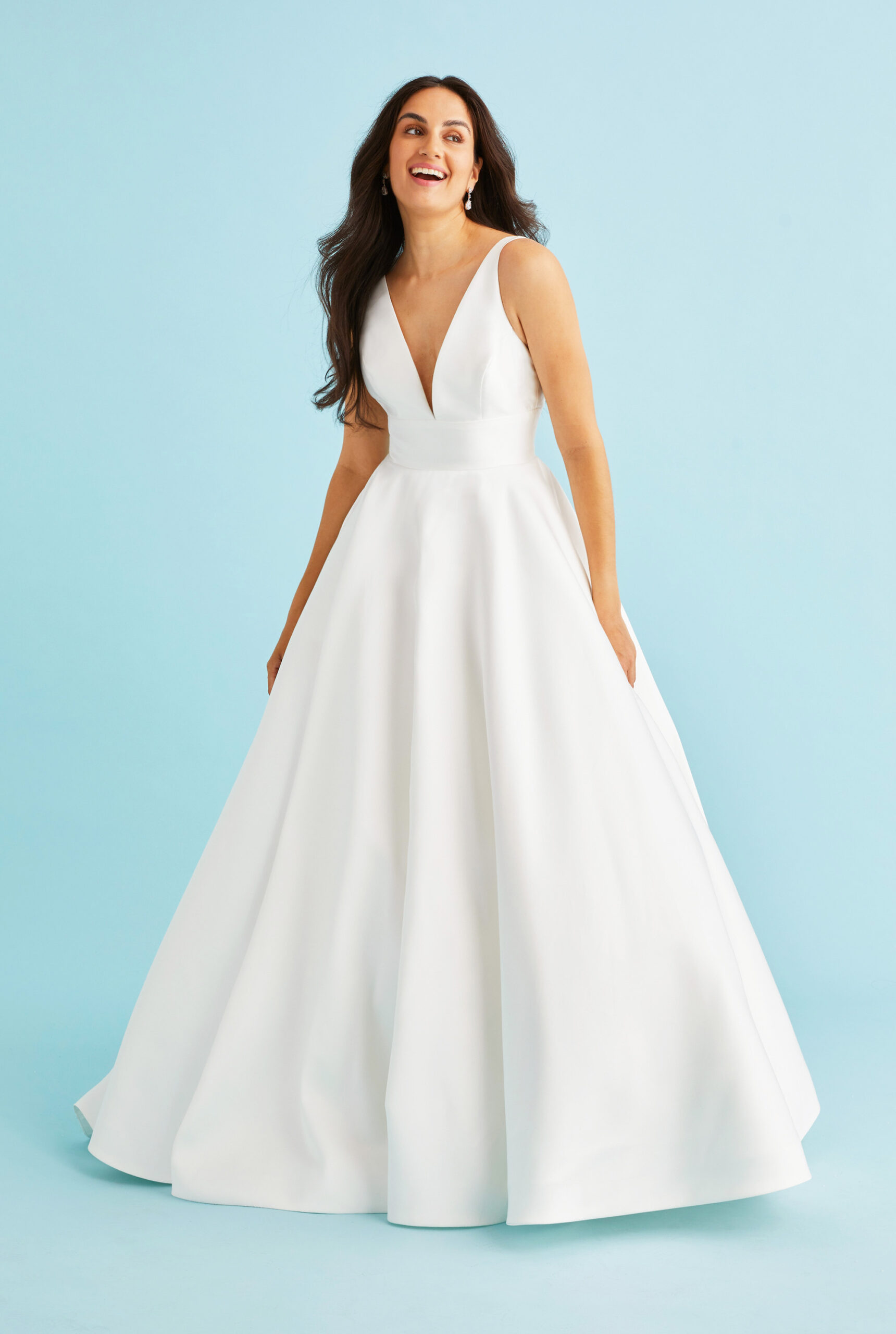 Front view of Brielle mikado wedding dress featuring a dramatic plunging V-neckline that creates a bold focal point, with the architectural bodice flowing into a full circle skirt with practical hidden pockets, handcrafted by Lea-Ann Belter Toronto bridal gown.