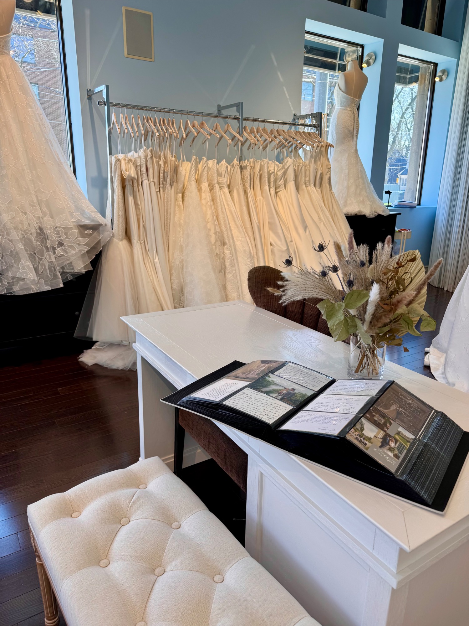 Inside Lea-Ann Belter Bridal boutique with wedding dresses and consultation desk