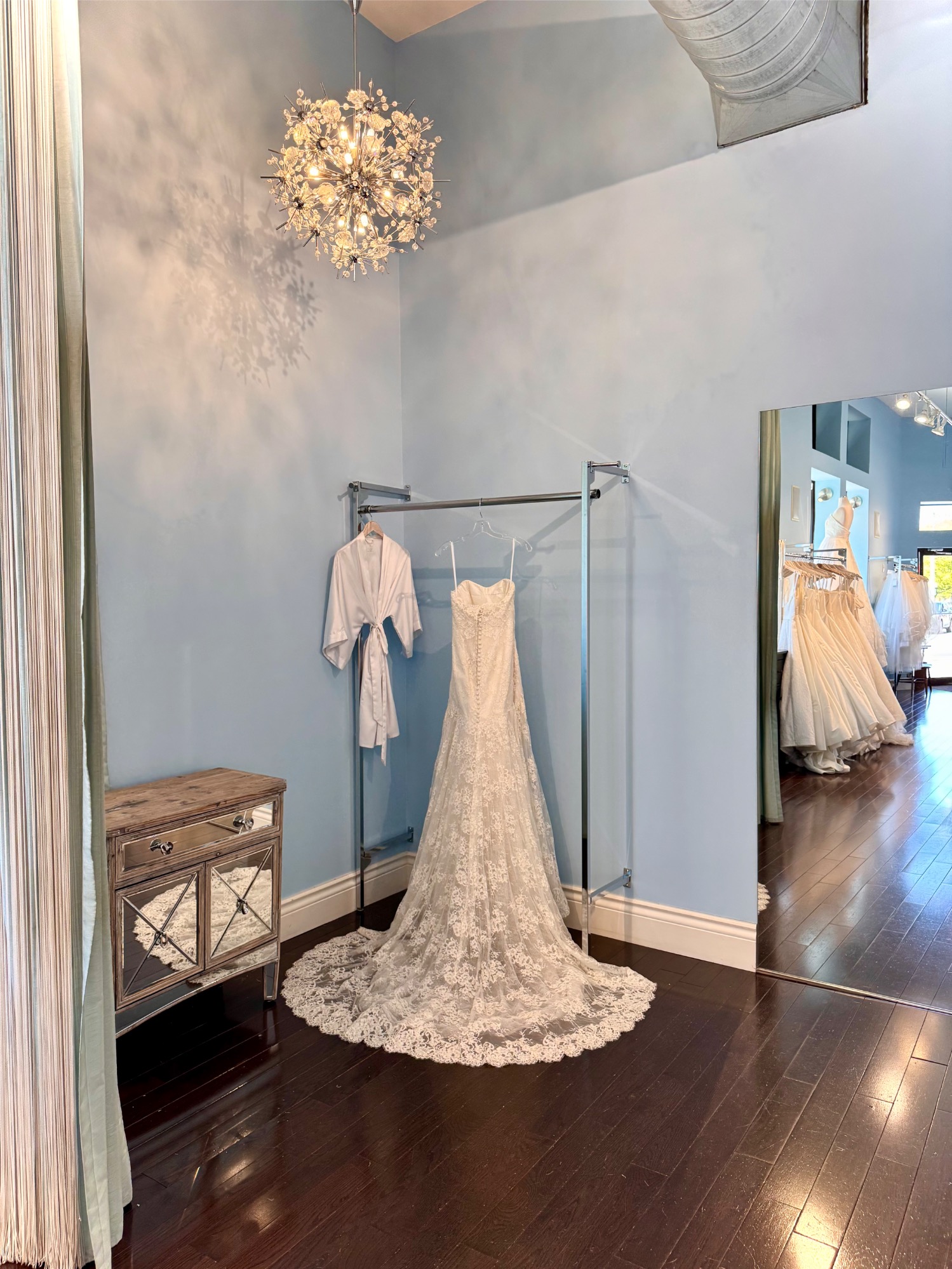 Lace wedding gown in fitting area at Lea-Ann Belter’s Toronto bridal shop