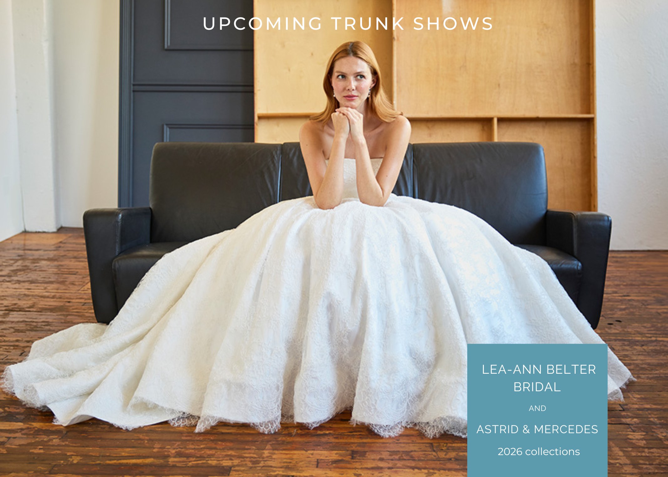 Bride in elegant white ballgown wedding dress sitting thoughtfully on dark sofa, promoting Lea-Ann Belter Bridal and Astrid & Mercedes 2026 trunk shows