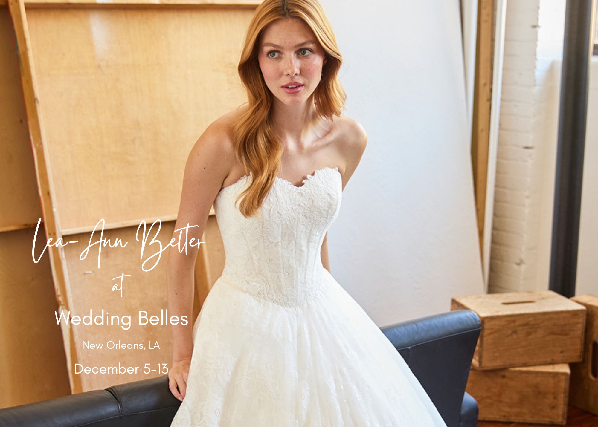 Bride trying on Lea-Ann Belter strapless lace ballgown wedding dress at Wedding Belles bridal boutique