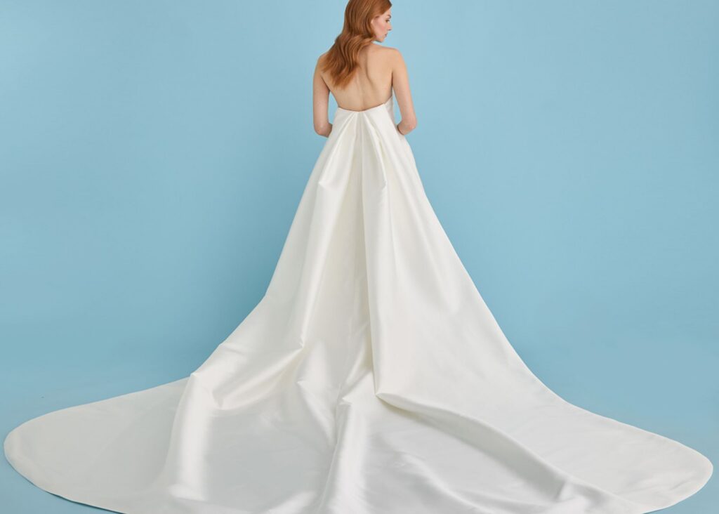 Back view of a Lea-Ann Belter bridal gown with the Hyde Park detachable Watteau train in structured off-white mikado