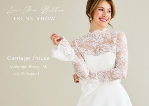 A bride wearing a sheer lace bolero with a hisgh neck and long sleevs over a classic silk crepe wedding dress with her hair piled on her hear.